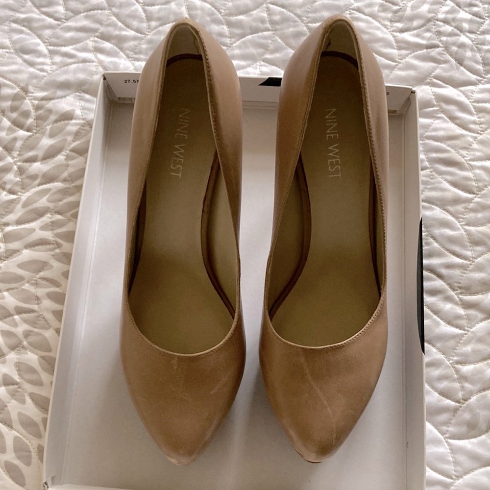 Tan Nine West 7.5 heels w/ wooden heel. Has scuffs. Worn 3 times w/ love.